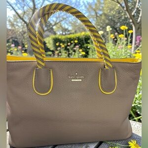 kate spade taupe tote with yellow trim and striped handles